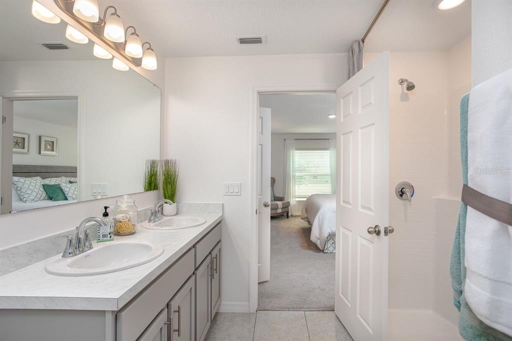6000 East Oneida Street Inverness, FL 34452 - Photo 27 of 32 a bathroom with a sink vanity granite and toilet
