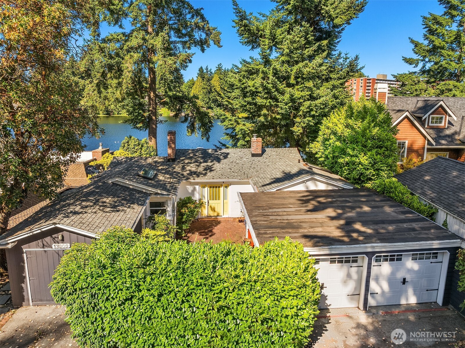 13302 Bitter Place North Seattle, WA 98133 - Photo 5 of 16 a view of a yard with plants and large trees
