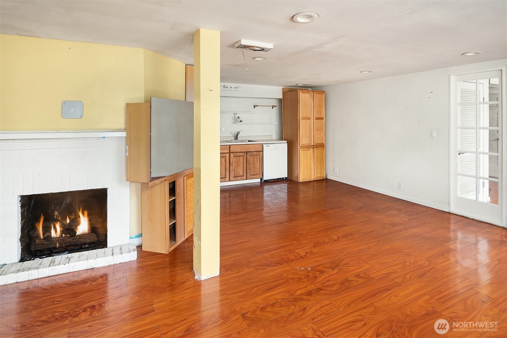 13302 Bitter Place North Seattle, WA 98133 - Photo 8 of 16 a view of a living room a window and a fireplace