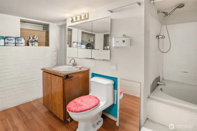 a bathroom with a sink toilet and shower