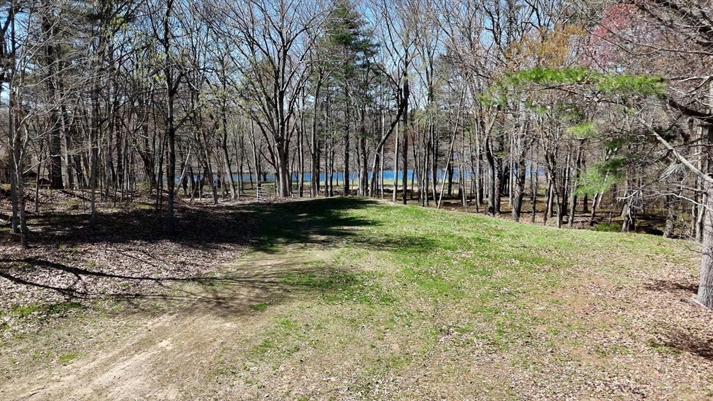 0 Wildwood Road East Brookfield, MA 01515 - Photo 18 of 38 a backyard of a house with lots of green space