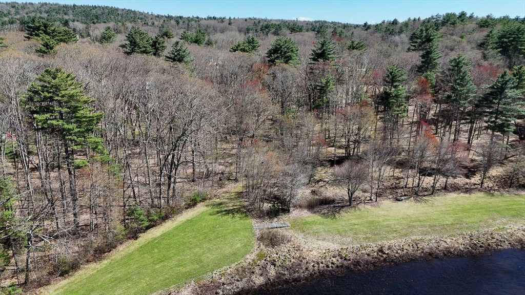 0 Wildwood Road East Brookfield, MA 01515 - Photo 22 of 38 an aerial view of a yard with houses