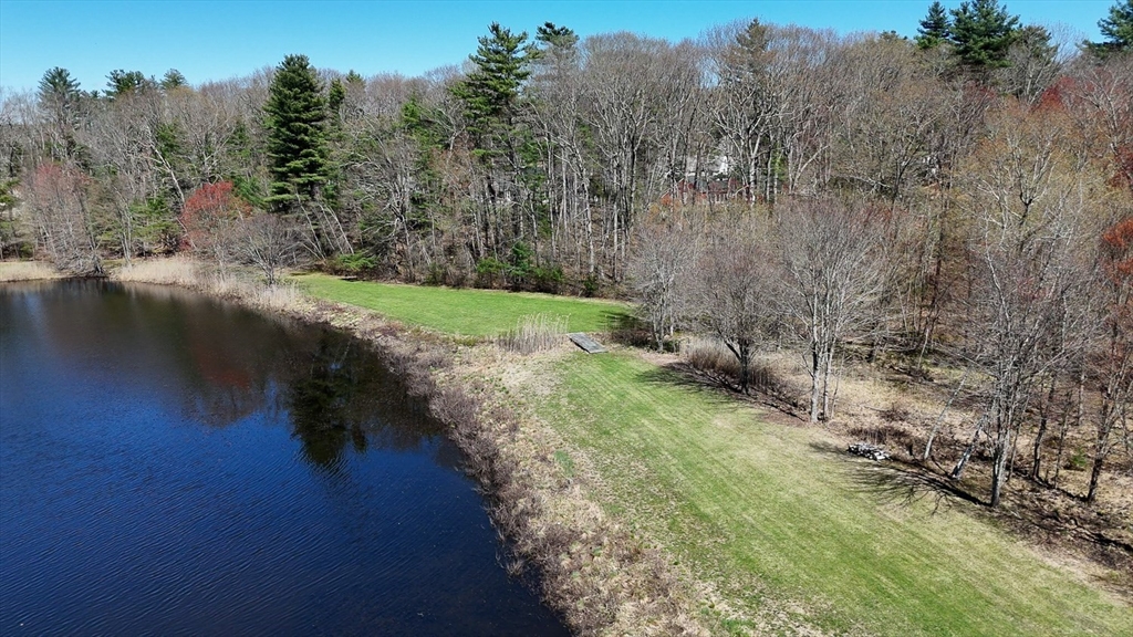 0 Wildwood Road East Brookfield, MA 01515 - Photo 4 of 38 a view of a lake with tall trees