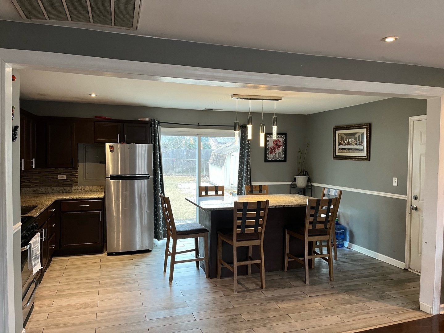 7 Ridge Circle Streamwood, IL 60107 - Photo 2 of 8 a view of a dining room with furniture window and wooden floor