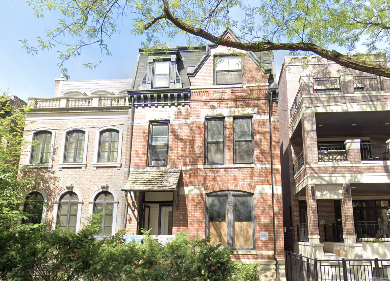 2052 North Dayton Street, Unit 2R Chicago, IL 60614 - Photo 1 of 11 a view of a white building with large windows
