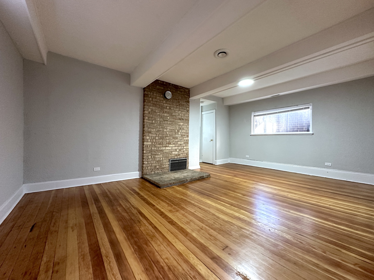 2052 North Dayton Street, Unit 2R Chicago, IL 60614 - Photo 3 of 11 a view of empty room with wooden floor and fan