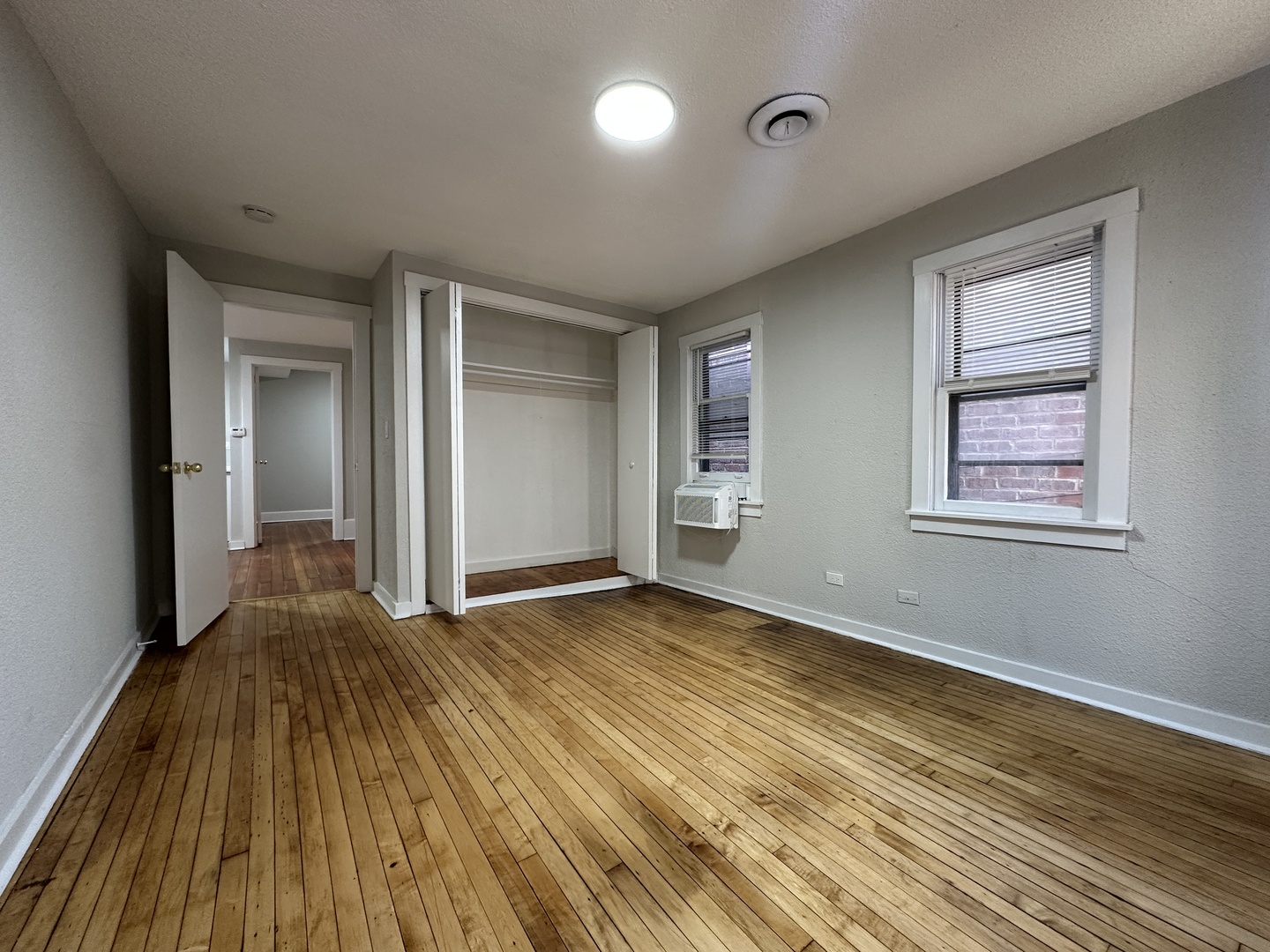 2052 North Dayton Street, Unit 2R Chicago, IL 60614 - Photo 9 of 11 a view of an empty room with wooden floor