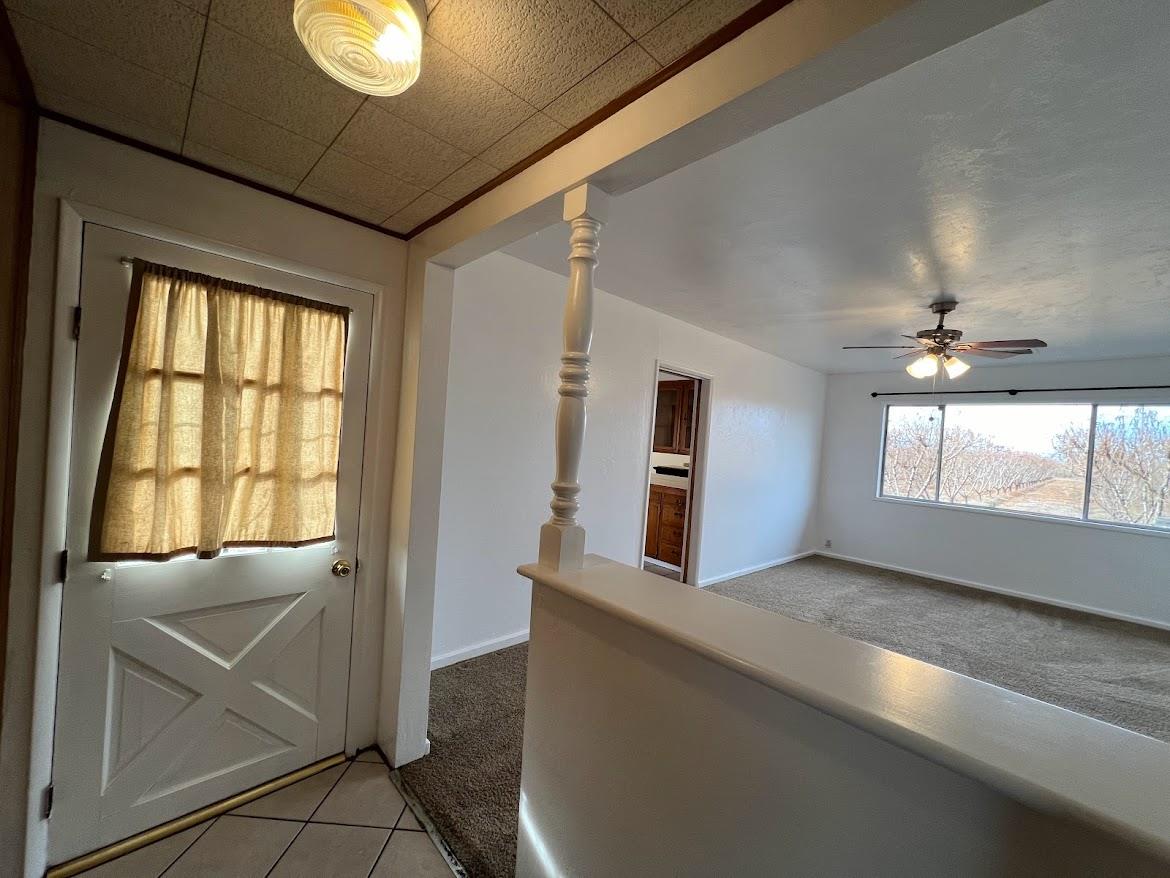 16109 East Manning Reedley, CA 93654 - Photo 14 of 30 a view of hallway with window and chandelier