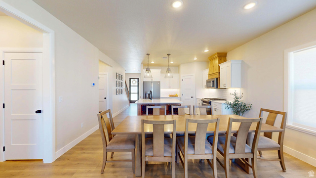 1127 4240 North Enoch, UT 84721 - Photo 11 of 56 Dining room featuring light wood-type flooring and recessed lighting