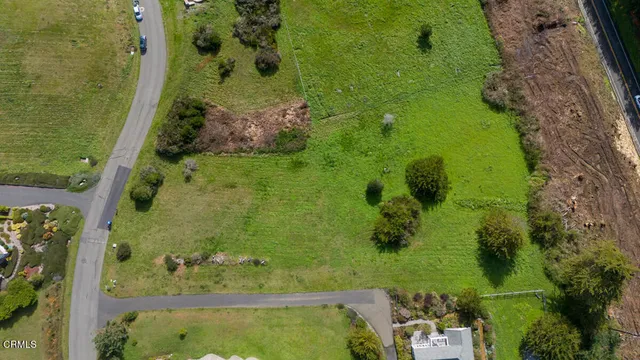 an aerial view of a residential houses with outdoor space