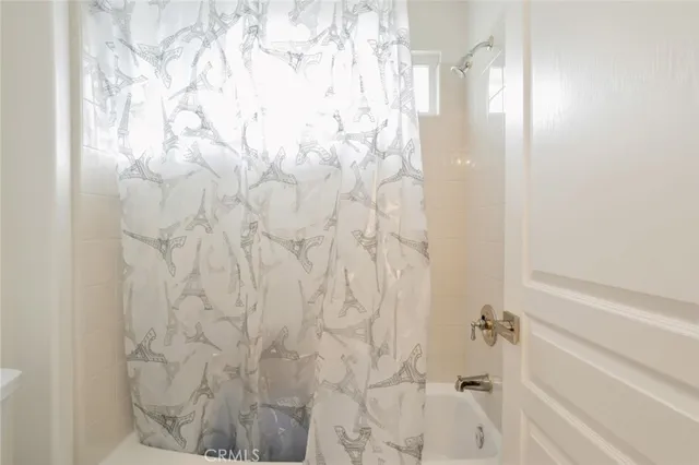 a bathroom with a shower curtain