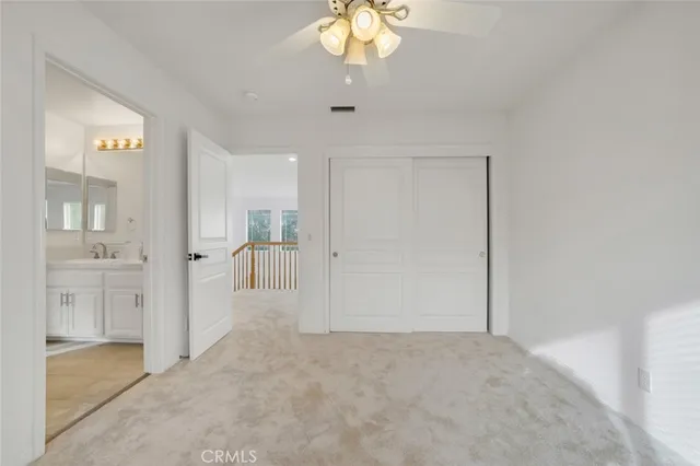a utility room with cabinets washer and dryer