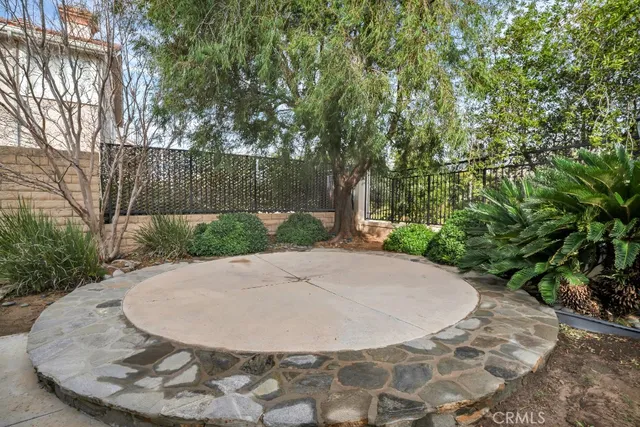 a view of a couches and table under an umbrella
