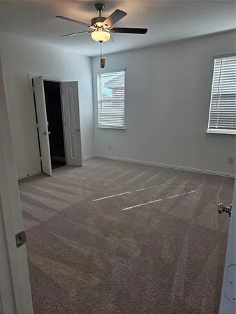 a view of empty room with windows