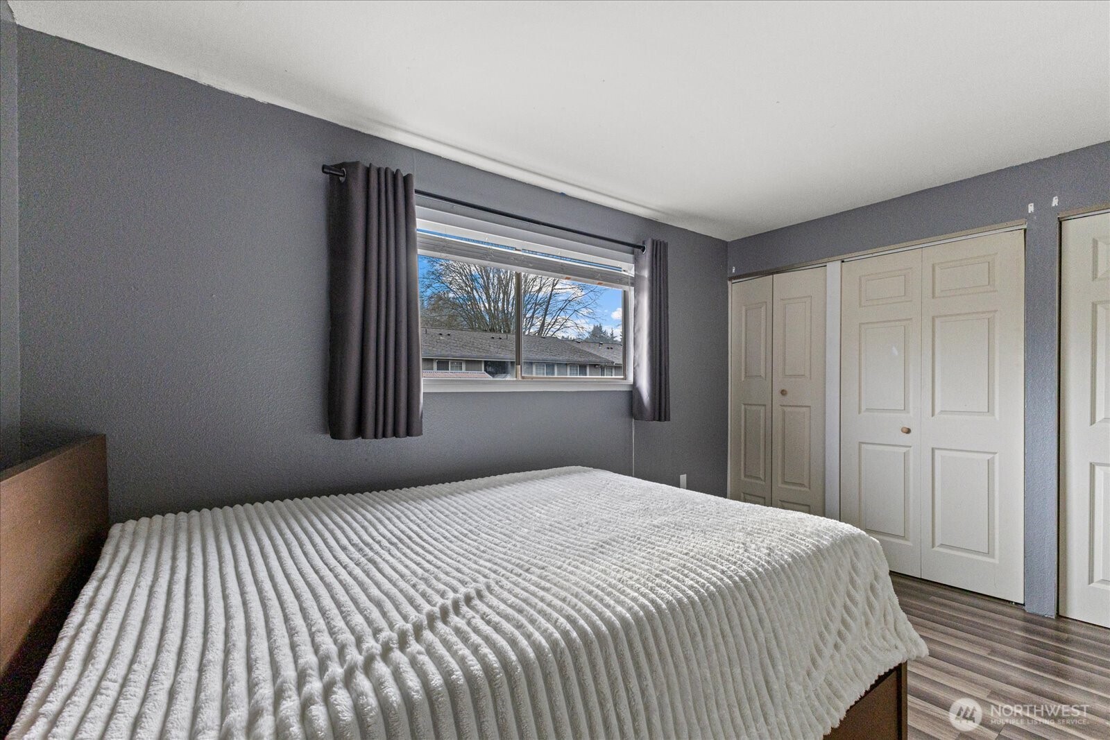 1016 9th Street Southeast, Unit 7 Puyallup, WA 98372 - Photo 15 of 29 a bedroom with a bed and a window