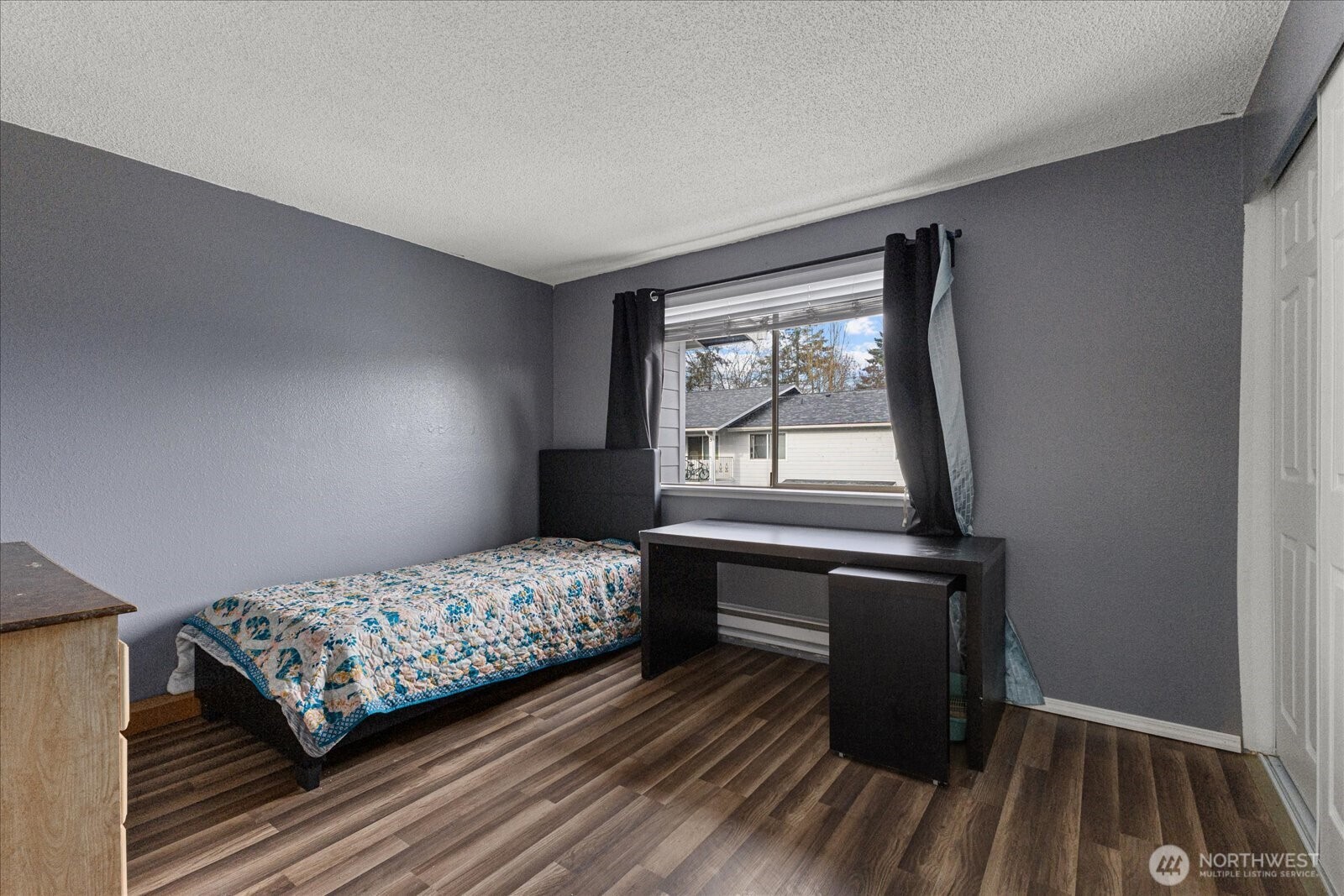 1016 9th Street Southeast, Unit 7 Puyallup, WA 98372 - Photo 17 of 29 a bedroom with a bed and a window