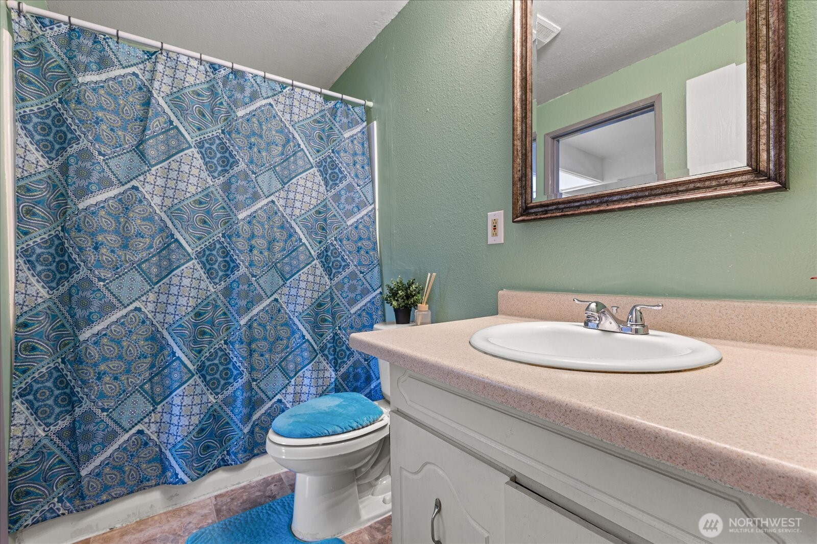 1016 9th Street Southeast, Unit 7 Puyallup, WA 98372 - Photo 18 of 29 a bathroom with a sink a toilet and a mirror