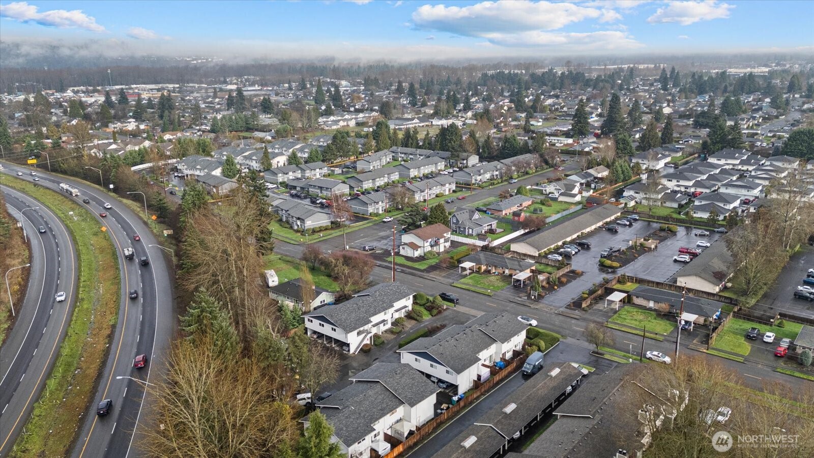 1016 9th Street Southeast, Unit 7 Puyallup, WA 98372 - Photo 23 of 29 an aerial view of a city with lots of residential buildings