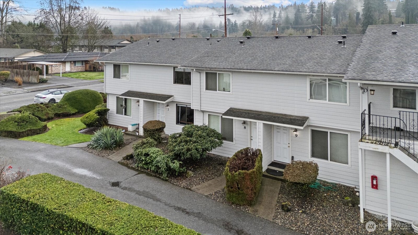 1016 9th Street Southeast, Unit 7 Puyallup, WA 98372 - Photo 23 of 25 a front view of a house with garden