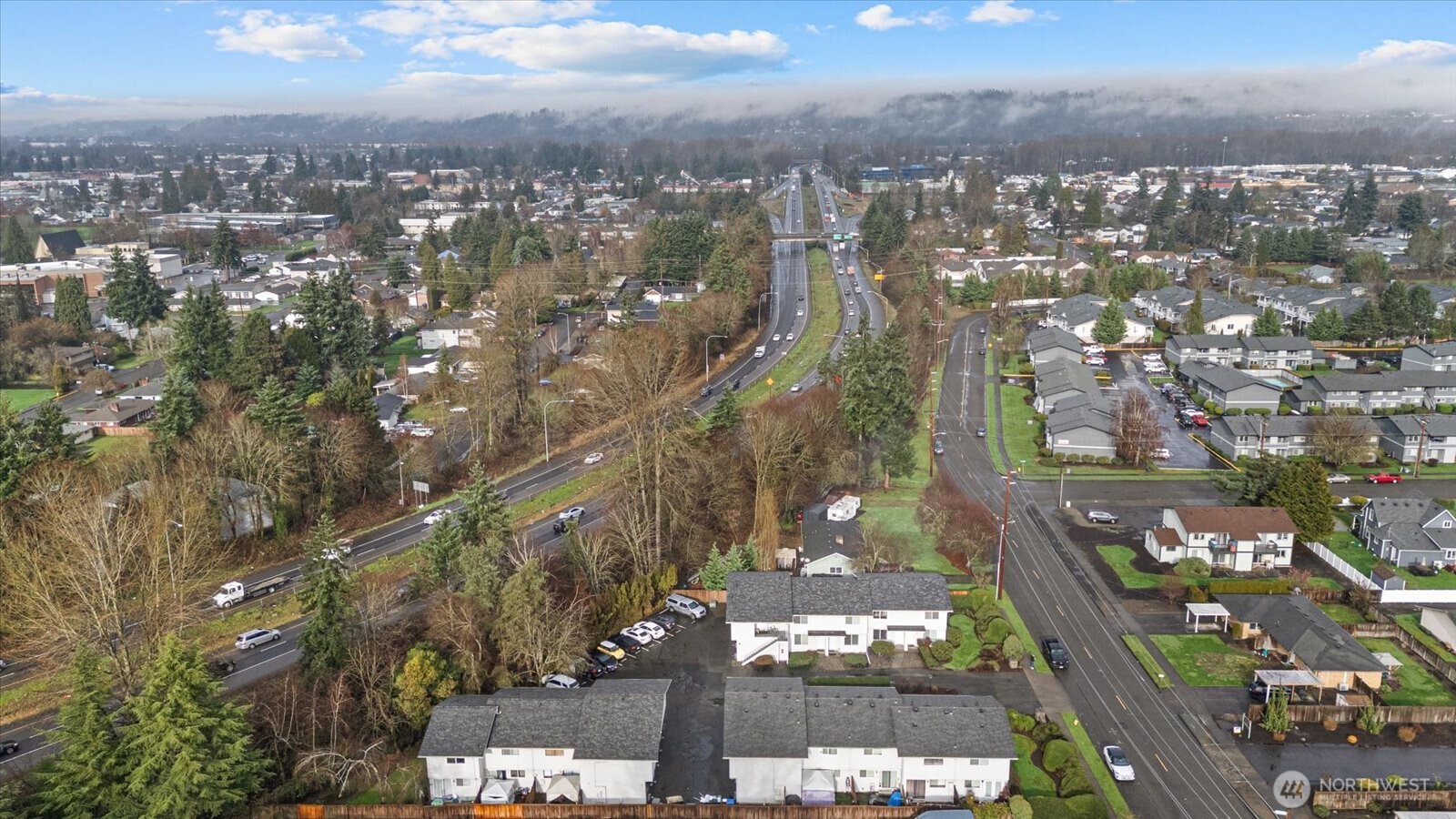 1016 9th Street Southeast, Unit 7 Puyallup, WA 98372 - Photo 24 of 29 a view of a city with tall buildings