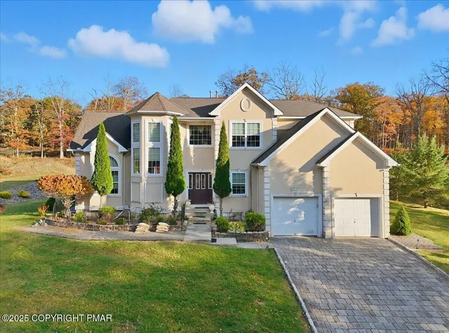 a view of a livingroom with furniture and staircase