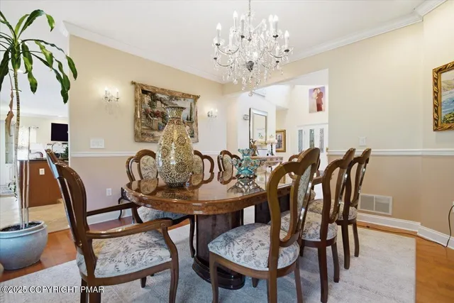 a bathroom with a sink a toilet a mirror and shower