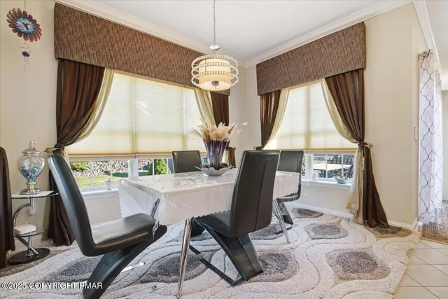 a living room with furniture and a dresser