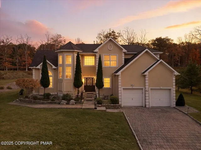 a view of a a dining room with furniture window and wooden floor