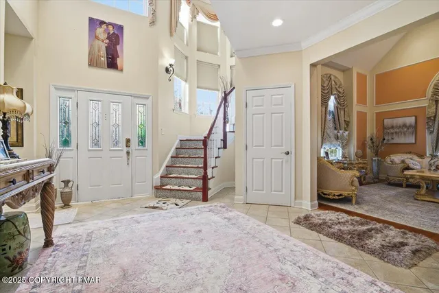 a bathroom with a granite countertop sink a toilet and a shower