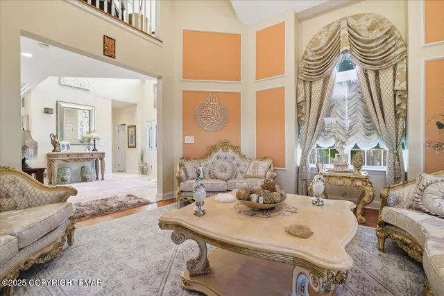 a spacious bedroom with a bed and a large window