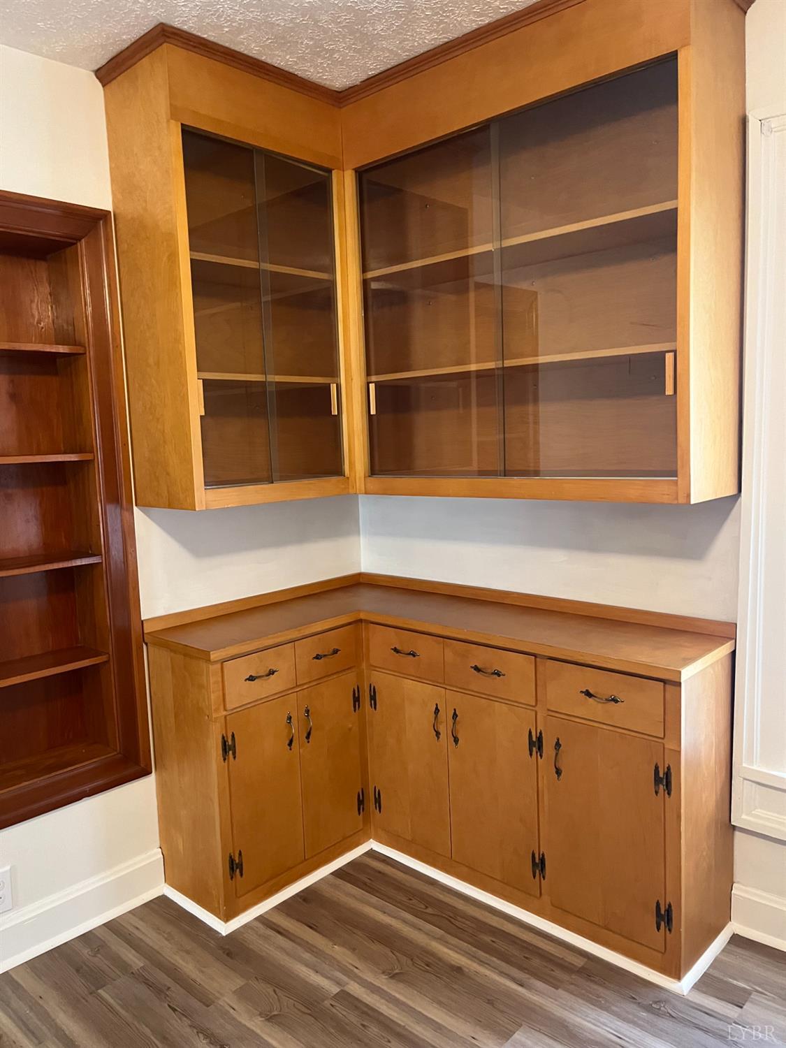 1109 Amherst Avenue Altavista, VA 24517 - Photo 15 of 23 a view of an empty room with wooden floor and a window