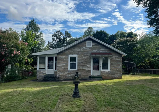 a front view of house with a garden