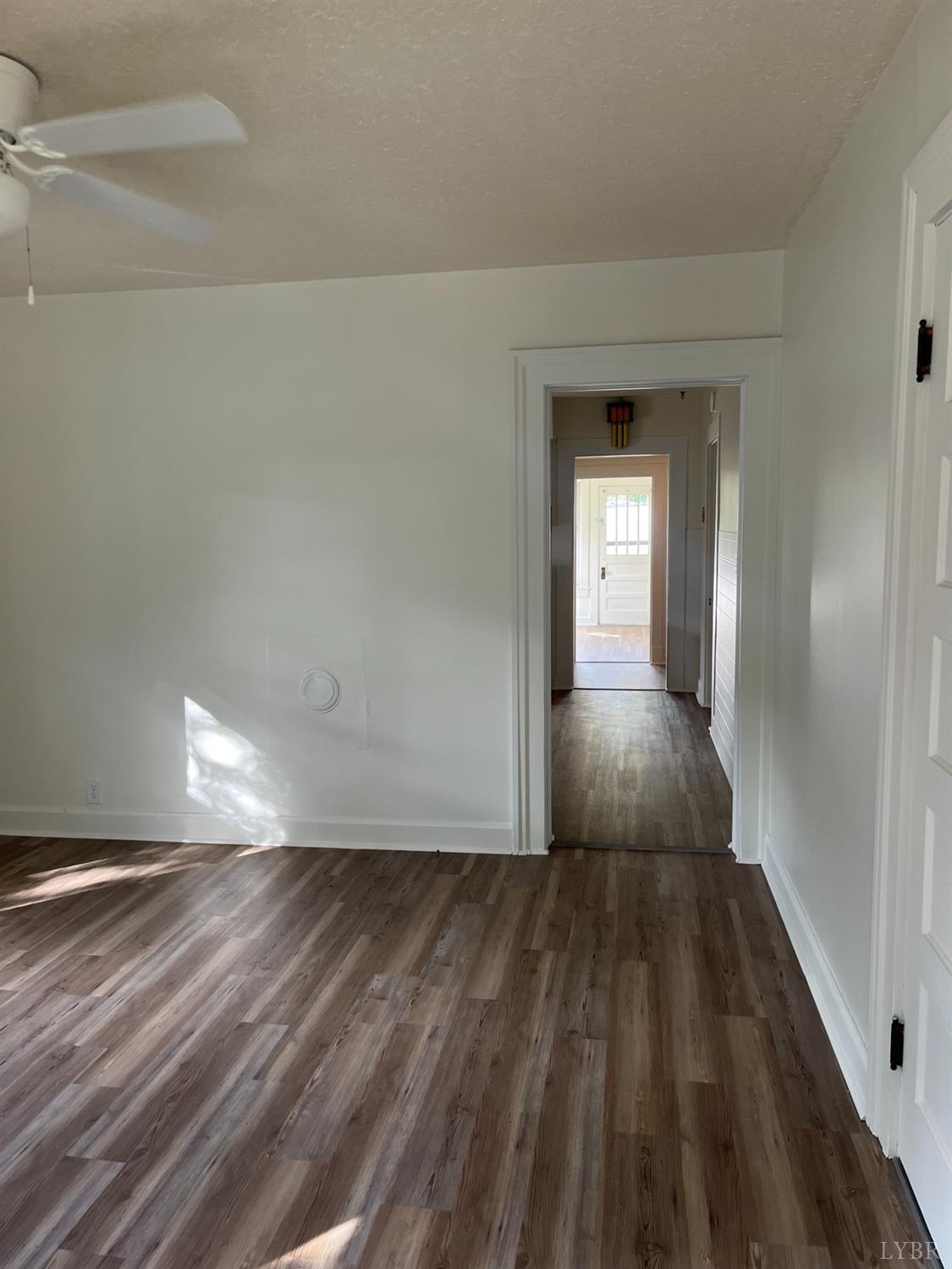 1109 Amherst Avenue Altavista, VA 24517 - Photo 3 of 23 a view of a room with wooden floor and stairs