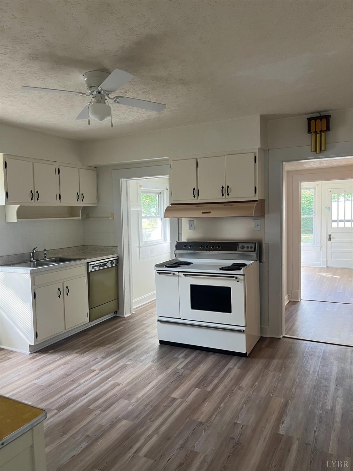 1109 Amherst Avenue Altavista, VA 24517 - Photo 4 of 23 a kitchen with stainless steel appliances a stove top oven and cabinets