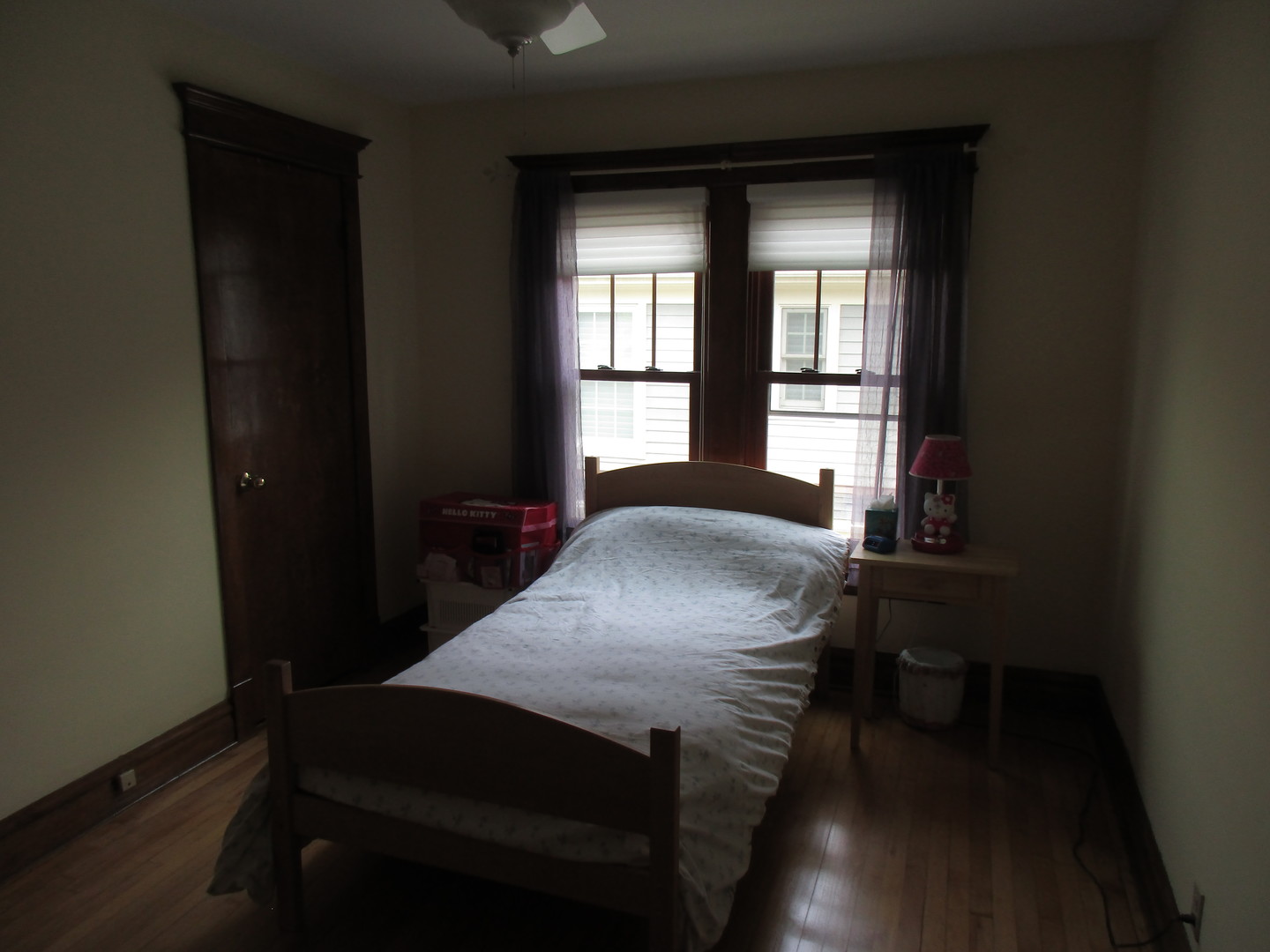 317 Shenstone Road Riverside, IL 60546 - Photo 18 of 21 a bed sitting in a bedroom next to a window
