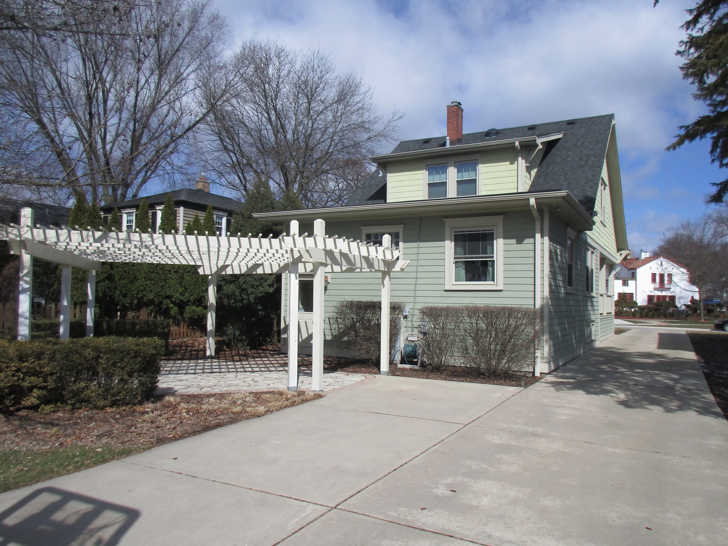 317 Shenstone Road Riverside, IL 60546 - Photo 2 of 21 a front view of a house with a yard and potted plants