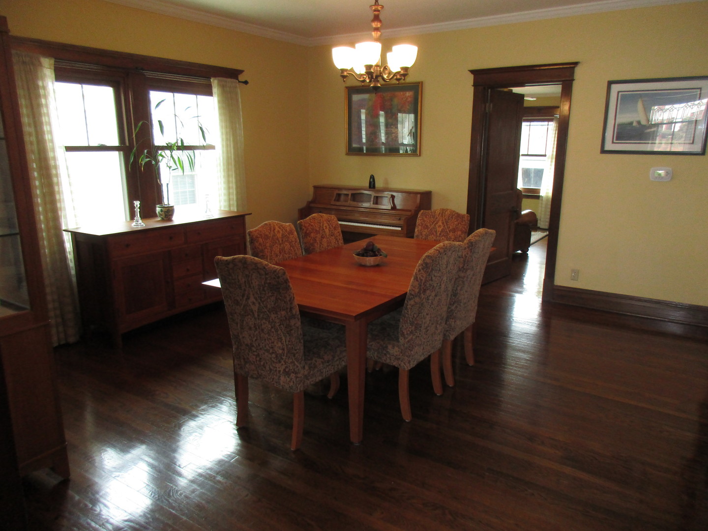 317 Shenstone Road Riverside, IL 60546 - Photo 7 of 21 a view of a dining room with furniture a chandelier and wooden floor