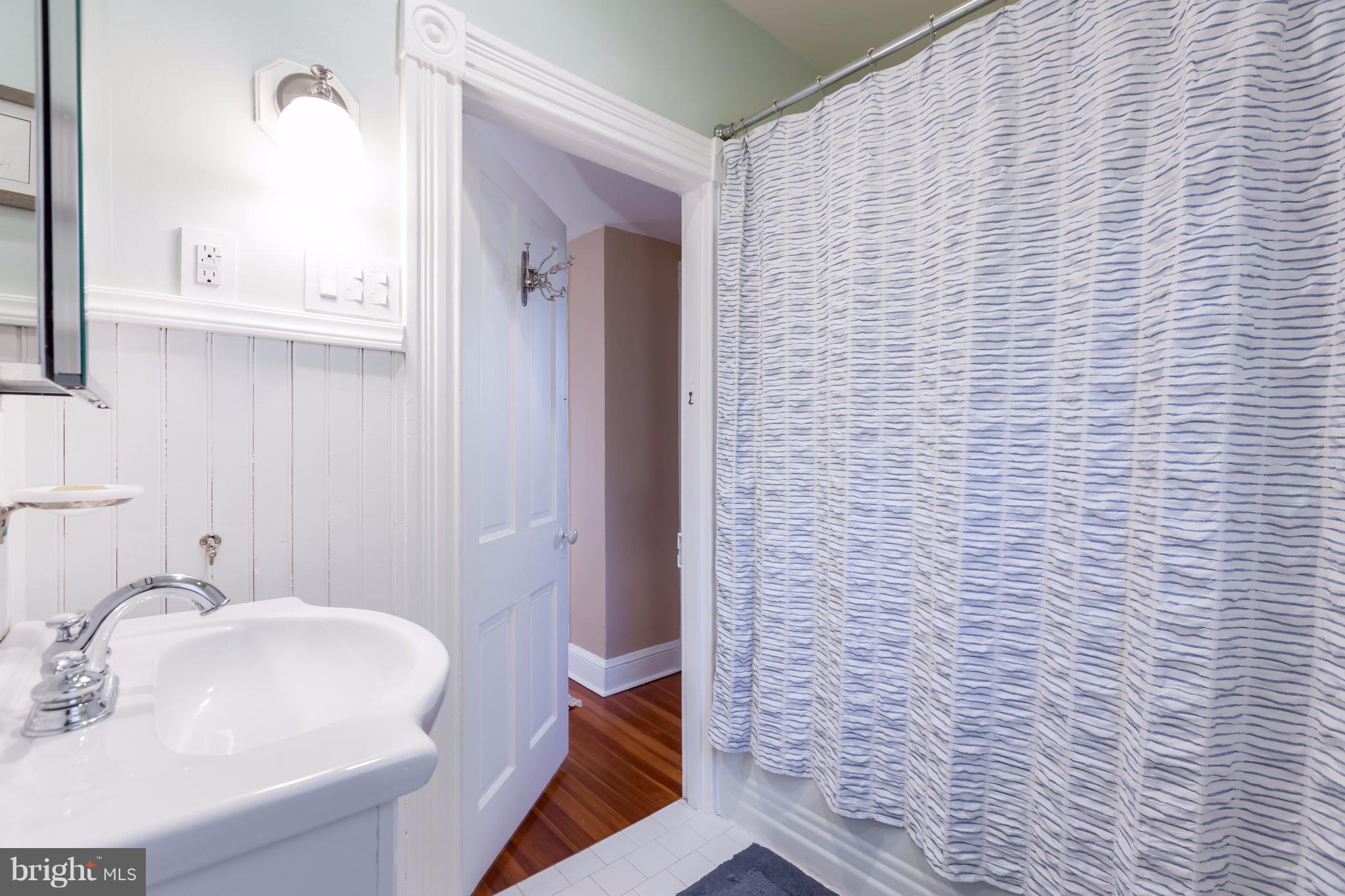 1405 Ridge Road Baltimore, MD 21228 - Photo 16 of 30 a bathroom with a sink and a mirror
