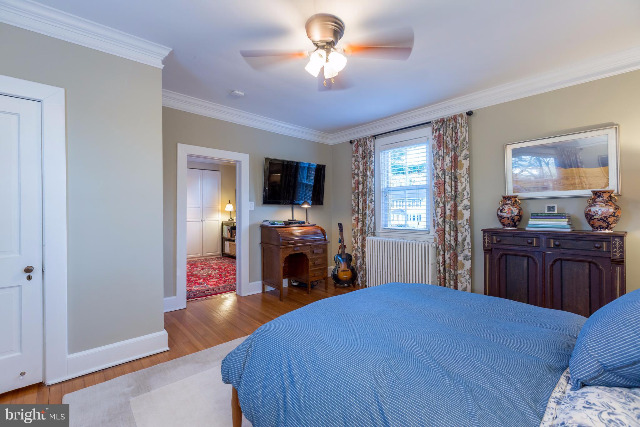 1405 Ridge Road Baltimore, MD 21228 - Photo 19 of 30 a bedroom with a bed and a fireplace