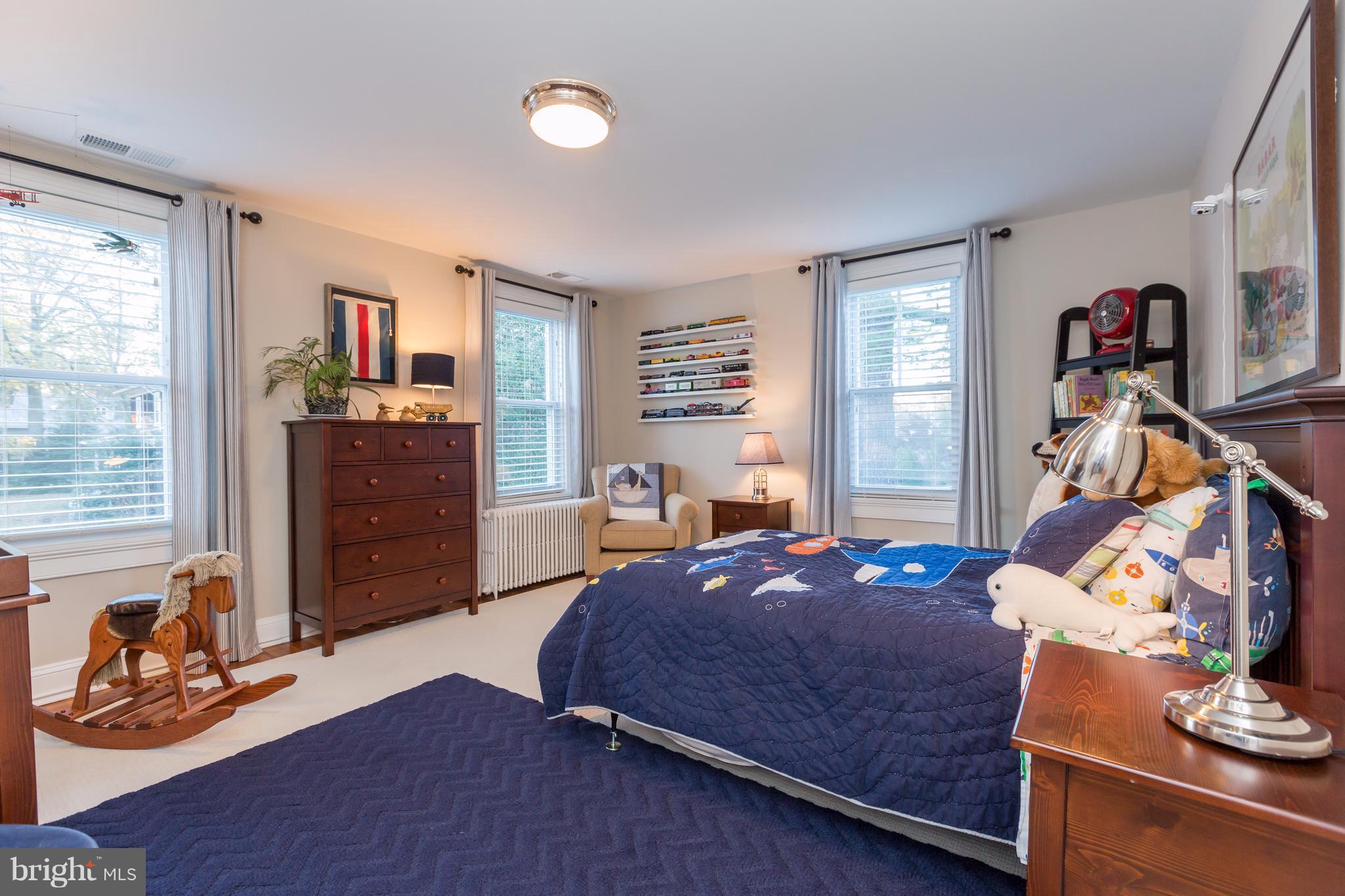 1405 Ridge Road Baltimore, MD 21228 - Photo 20 of 30 a bedroom with a bed and wooden floor