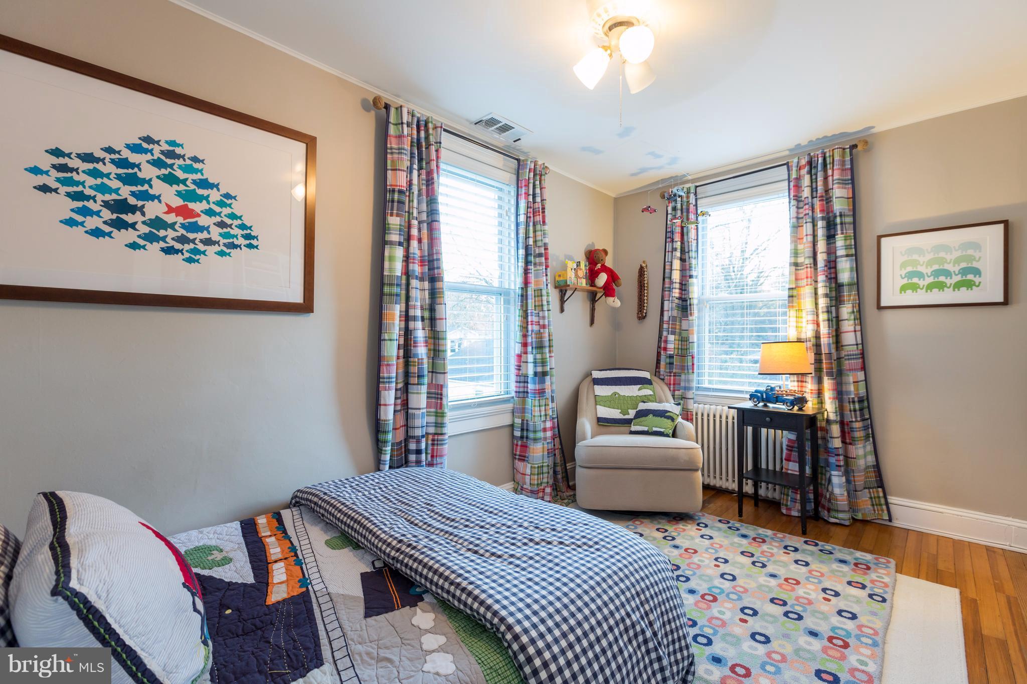 1405 Ridge Road Baltimore, MD 21228 - Photo 22 of 30 a bedroom with a bed and wooden floor