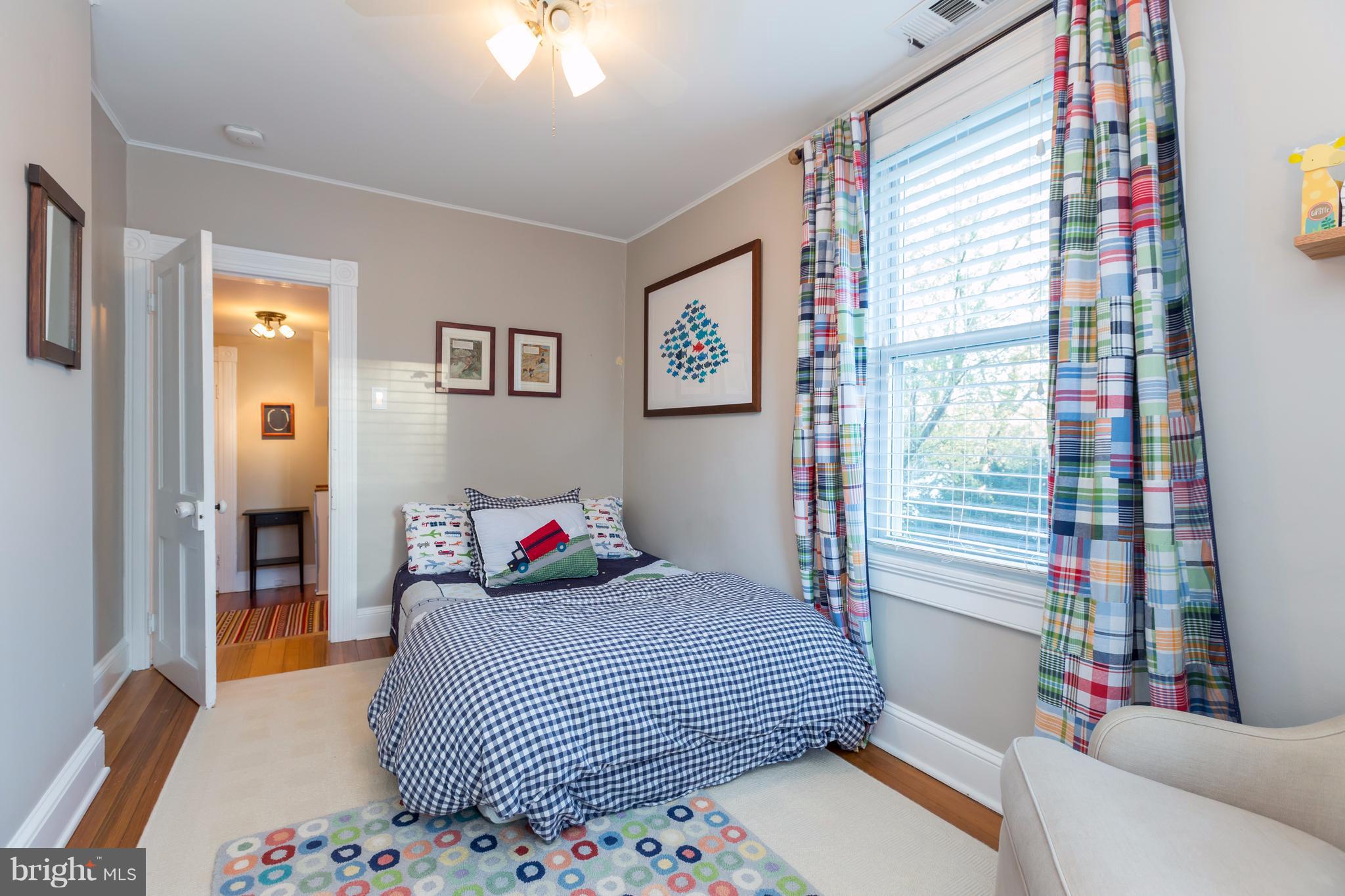 1405 Ridge Road Baltimore, MD 21228 - Photo 23 of 30 a bedroom with a bed and a couch