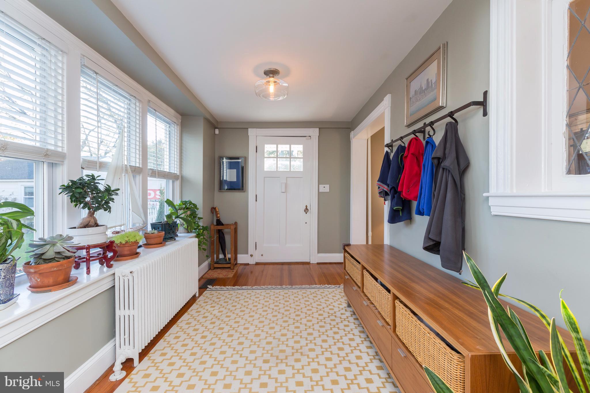 1405 Ridge Road Baltimore, MD 21228 - Photo 7 of 30 a hallway with flowers and stairs