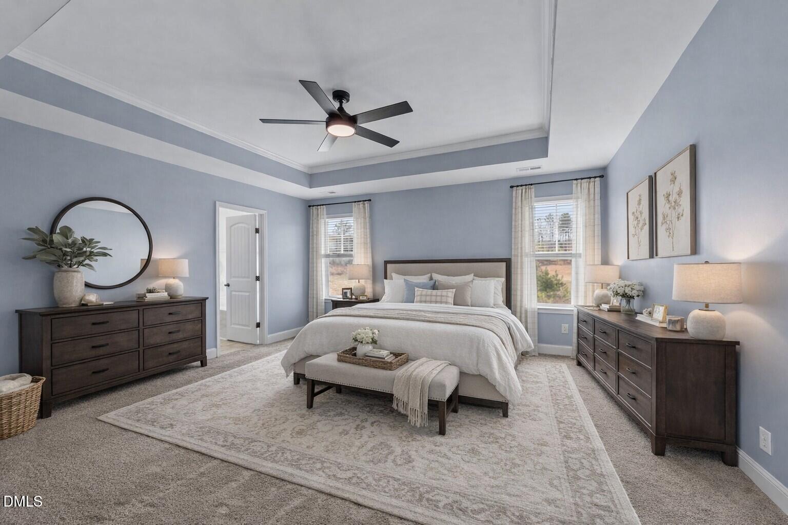 41 Solstice Lane Garner, NC 27529 - Photo 12 of 33 a bedroom with bed and a chandelier