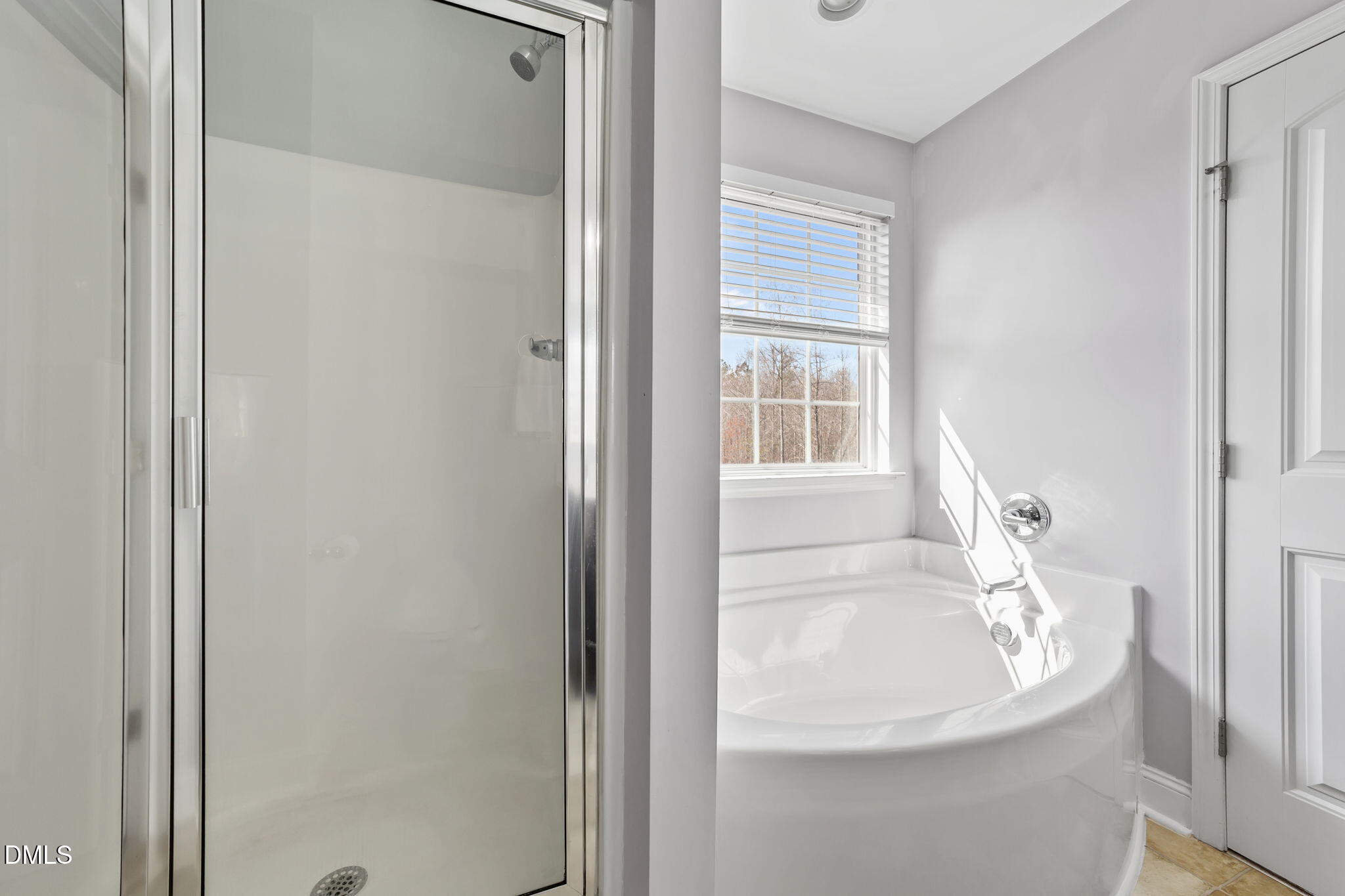 41 Solstice Lane Garner, NC 27529 - Photo 15 of 33 a white bath tub sitting next to a window