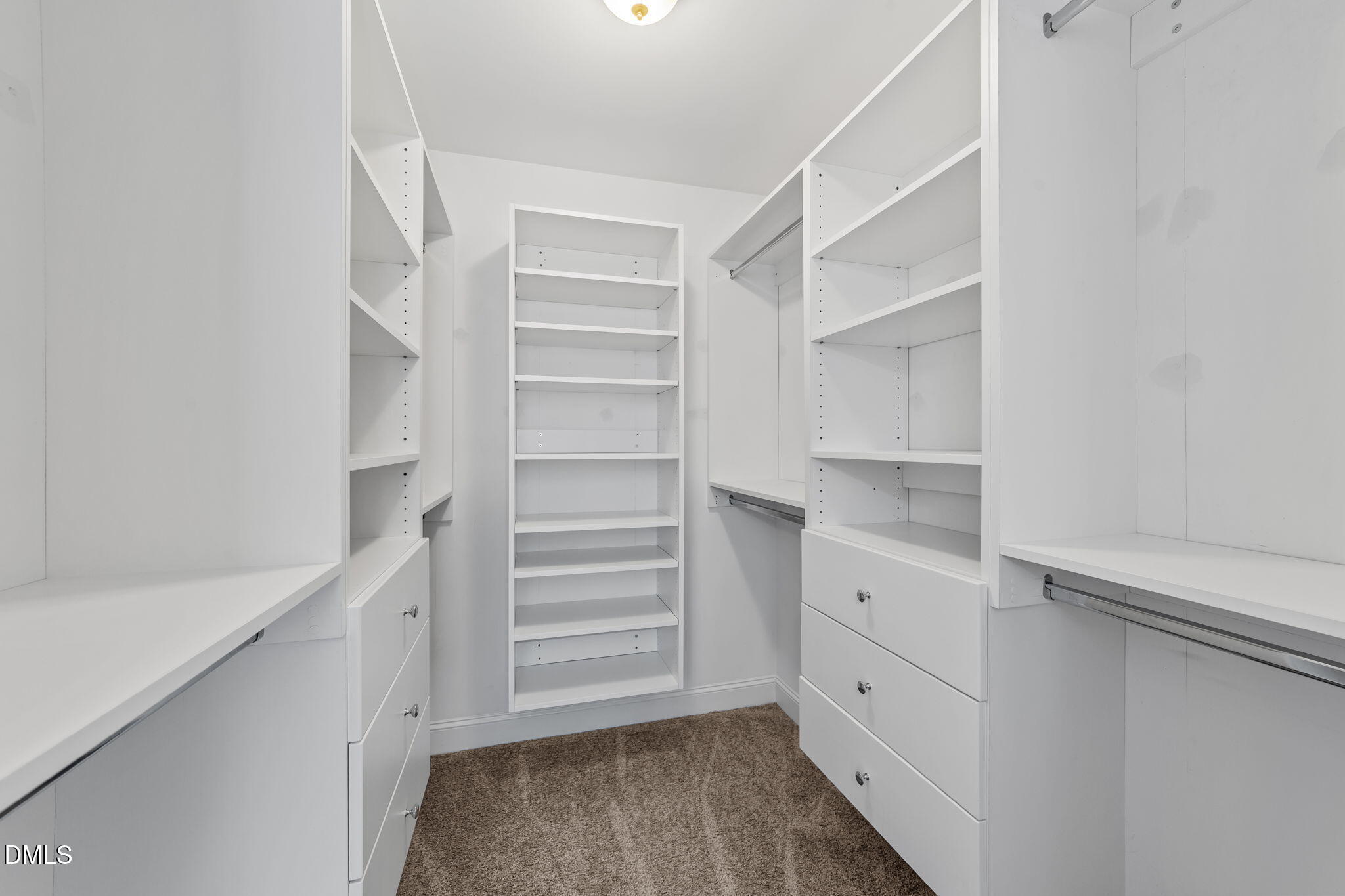 41 Solstice Lane Garner, NC 27529 - Photo 16 of 33 a view of walk in closet with empty racks