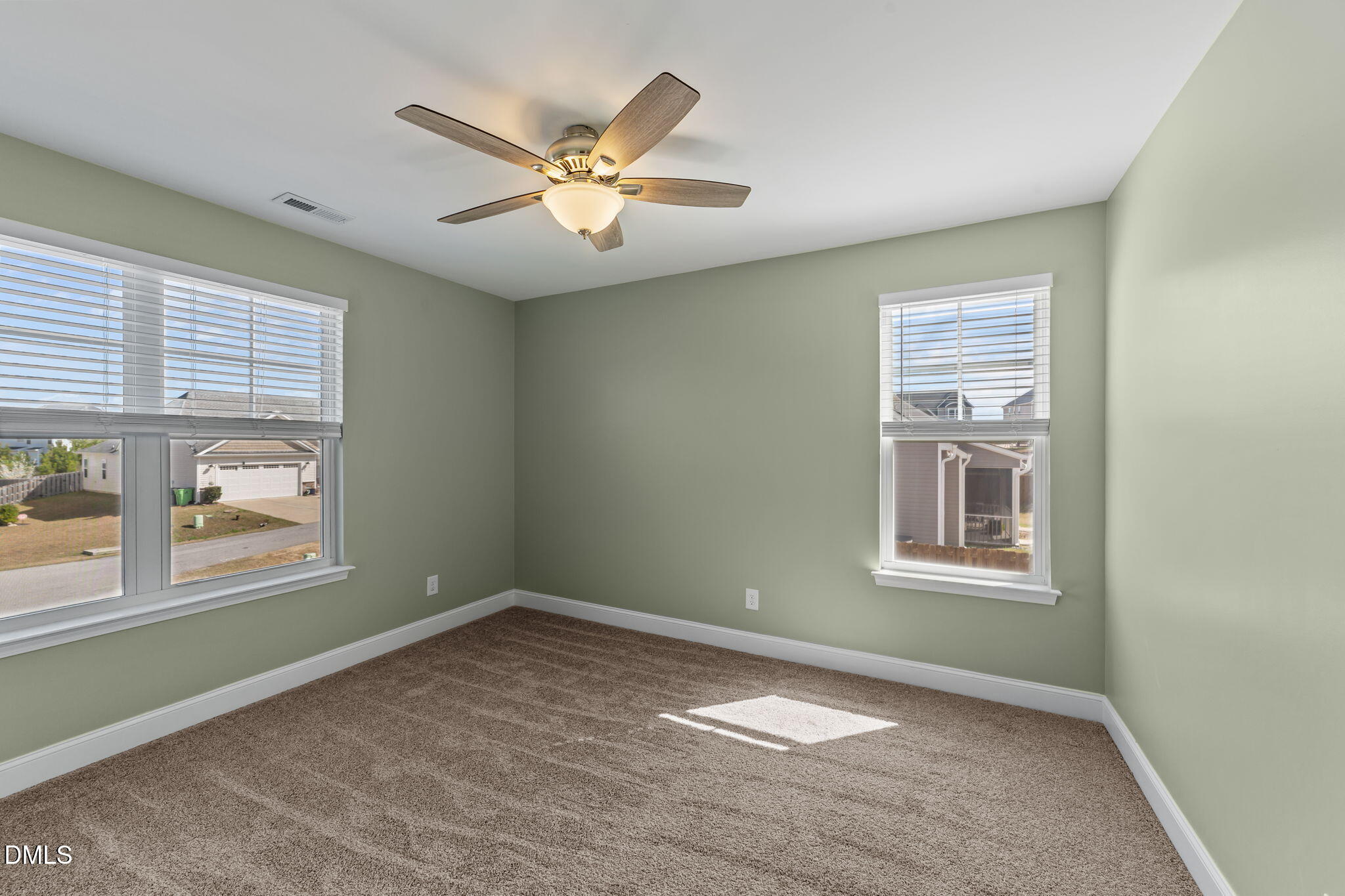 41 Solstice Lane Garner, NC 27529 - Photo 19 of 33 an empty room with windows and fan