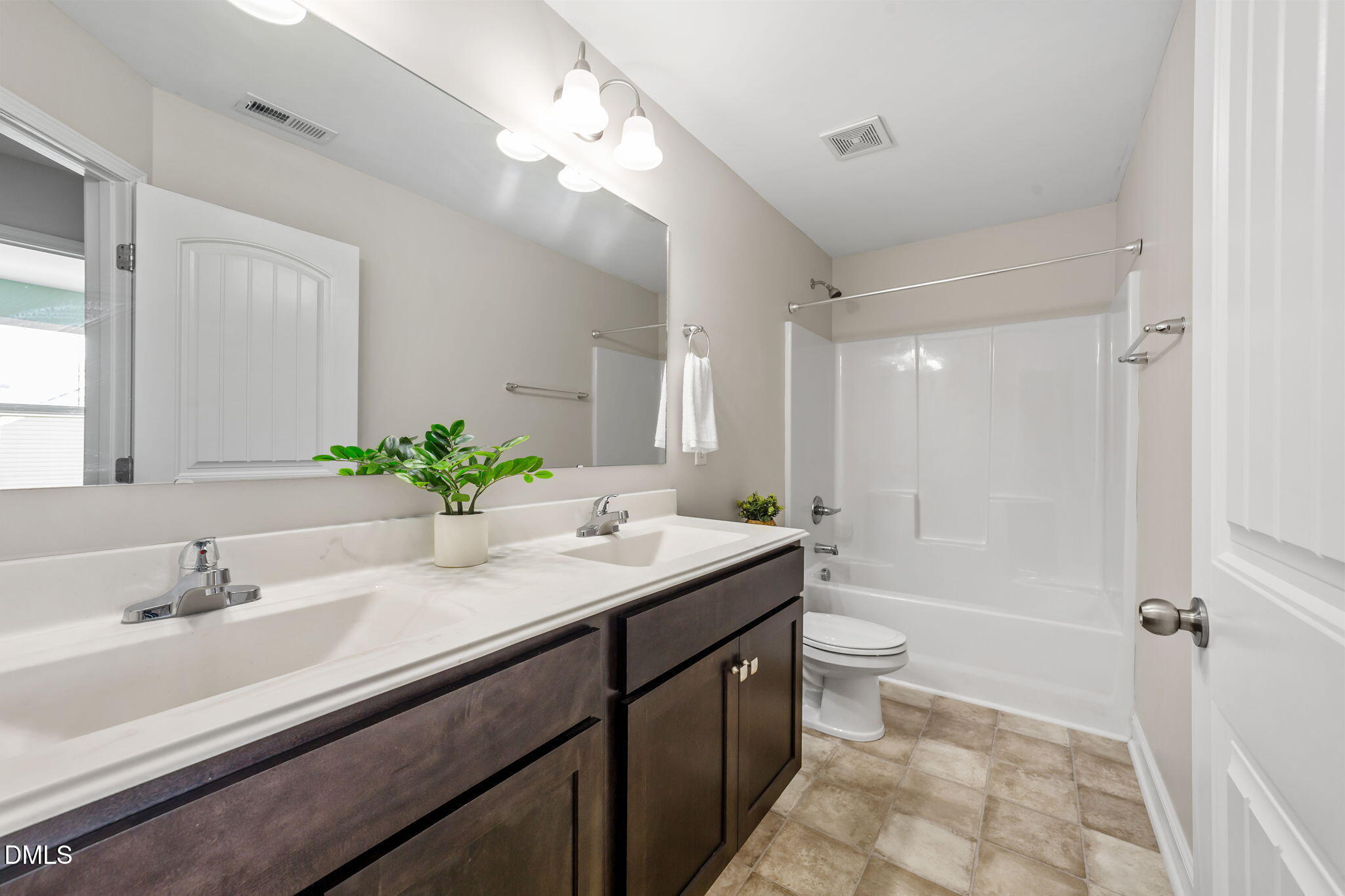 41 Solstice Lane Garner, NC 27529 - Photo 21 of 33 a bathroom with a granite countertop sink mirror vanity and toilet