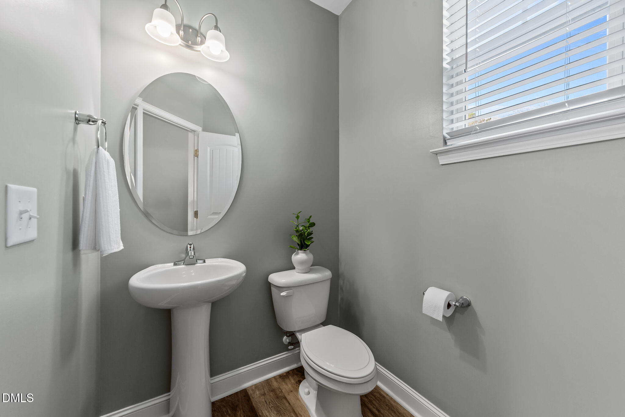 41 Solstice Lane Garner, NC 27529 - Photo 23 of 33 a bathroom with a toilet sink and mirror