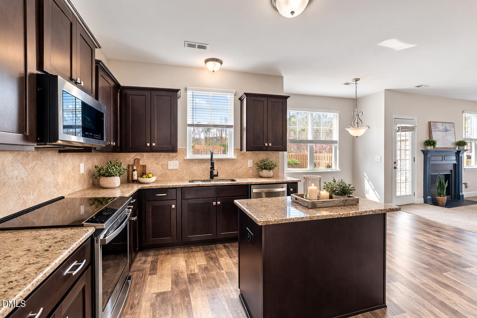 41 Solstice Lane Garner, NC 27529 - Photo 6 of 33 a kitchen with a sink stove and cabinets